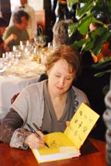 Alice Waters signs copies of her latest cookbook at the Cooks with Books event.