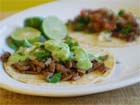 Add toppings to completed Mexican Tacos Bistek. Serve promptly.