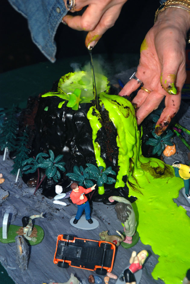 Cutting the amazing erupting volcano cake.