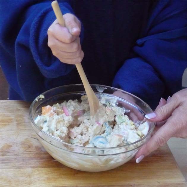 Mix Easter egg salad for sandwiches.