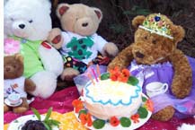 Taffy blows out her candles at the Teddy Bears' Picnic.