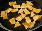 How to fry tortilla chips until crisp.